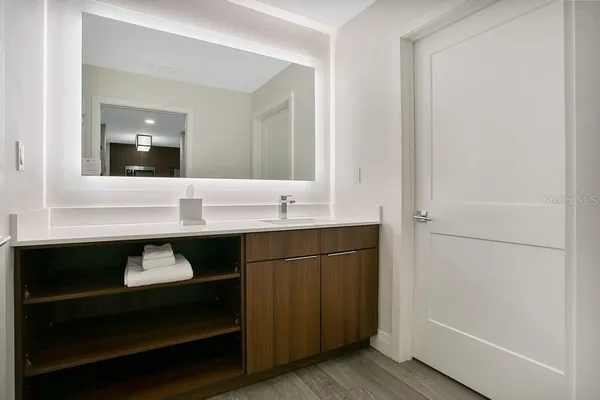 a bathroom with a sink and a mirror