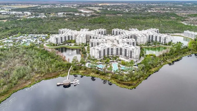 a aerial view of a house with a lake view