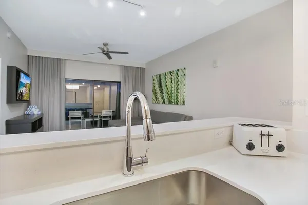 a kitchen with a sink and a refrigerator