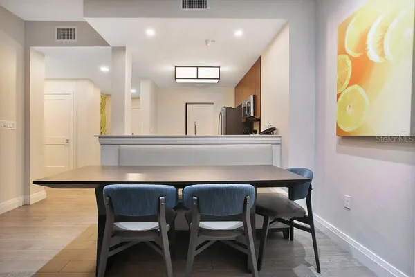 a kitchen with a table and chairs in it
