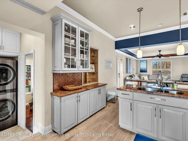a kitchen with stainless steel appliances granite countertop a sink and cabinets