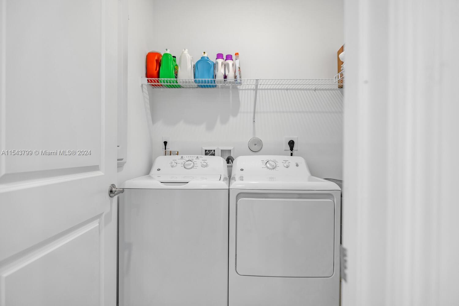 4242 Rosa Drive, Unit 4242 Deerfield Beach, FL 33064 - Photo 16 of 32 a utility room with dryer and washer