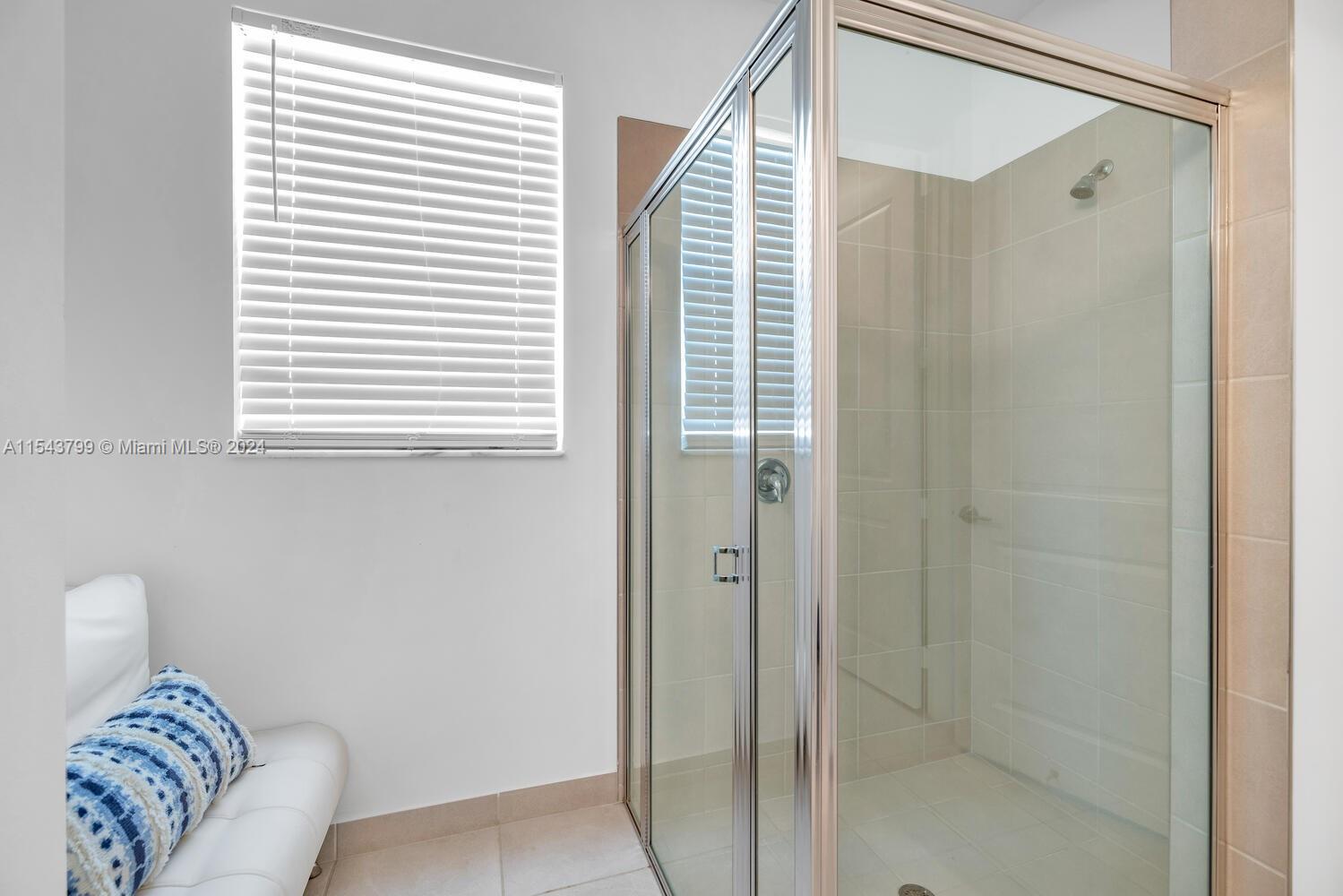 4242 Rosa Drive, Unit 4242 Deerfield Beach, FL 33064 - Photo 20 of 32 a bathroom with a bathtub and shower