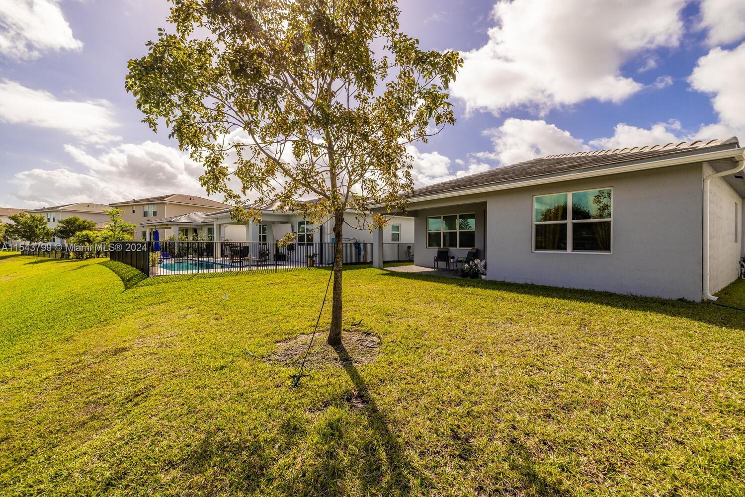 4242 Rosa Drive, Unit 4242 Deerfield Beach, FL 33064 - Photo 24 of 32 a view of a house with a backyard