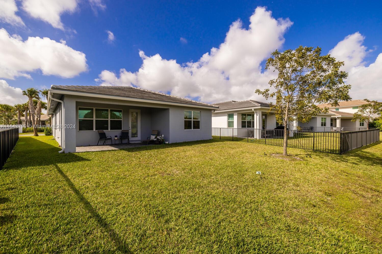 4242 Rosa Drive, Unit 4242 Deerfield Beach, FL 33064 - Photo 26 of 32 a view of a house with a backyard
