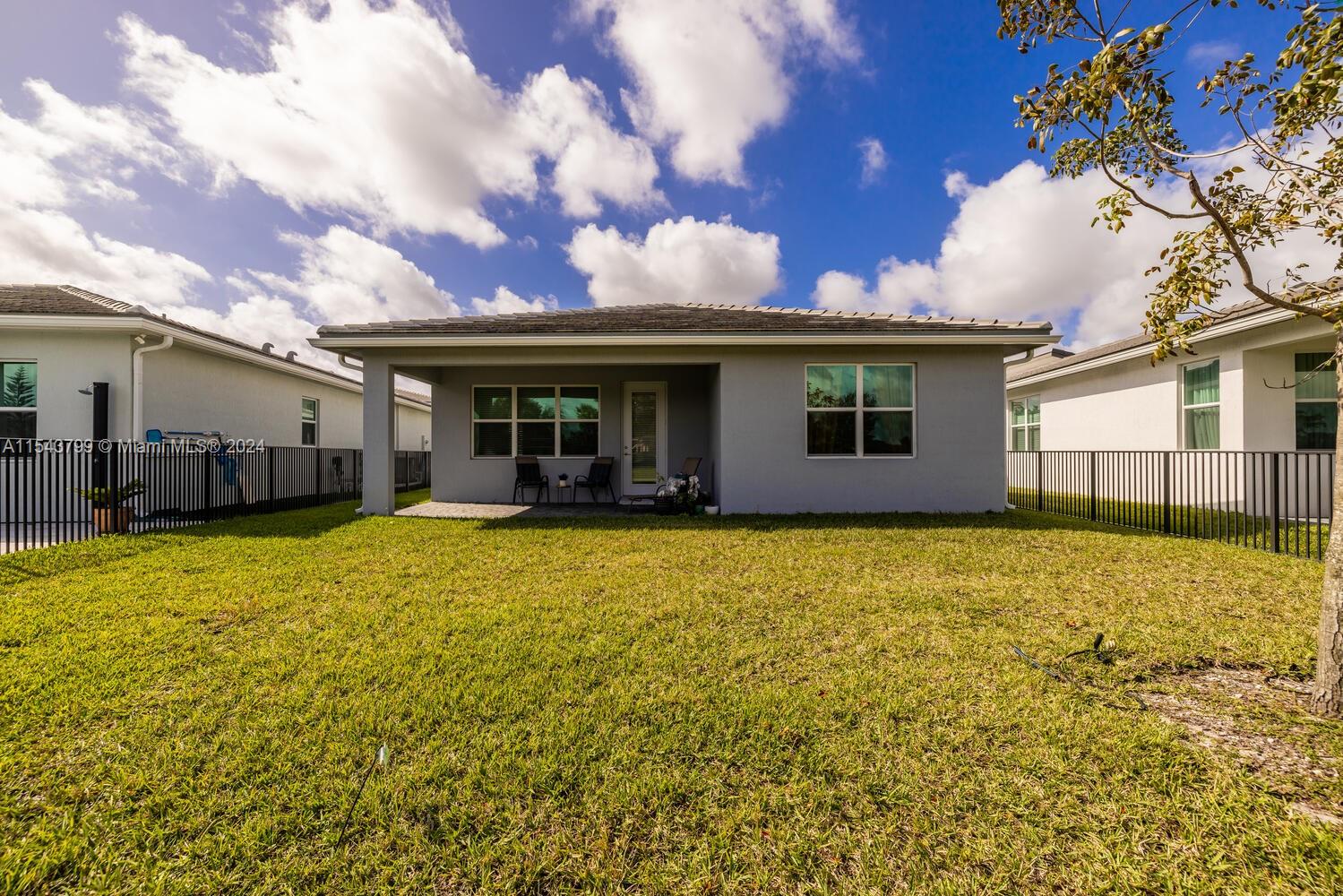 4242 Rosa Drive, Unit 4242 Deerfield Beach, FL 33064 - Photo 28 of 32 a view of a house with a backyard