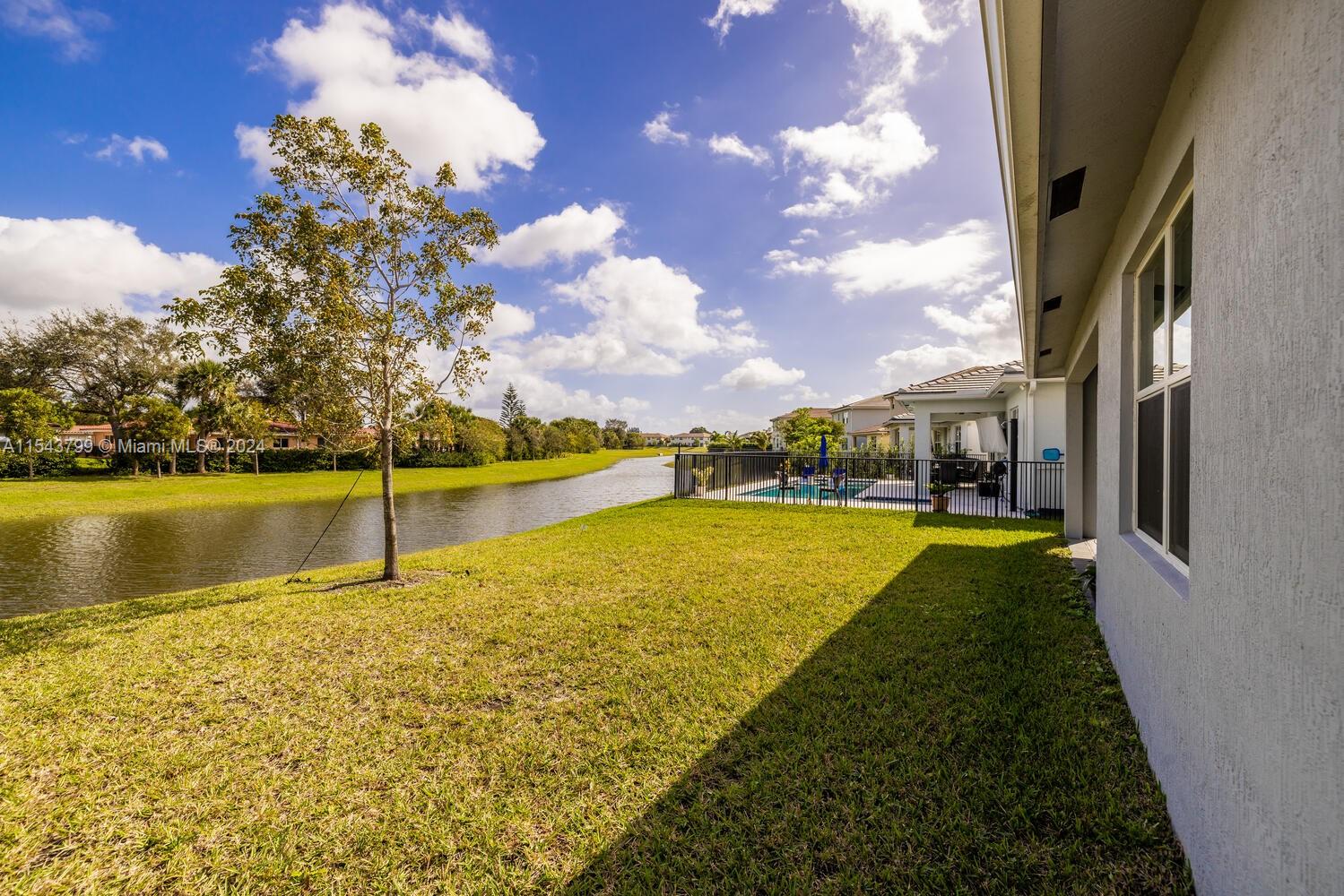 4242 Rosa Drive, Unit 4242 Deerfield Beach, FL 33064 - Photo 30 of 32 a view of an swimming pool with an outdoor space