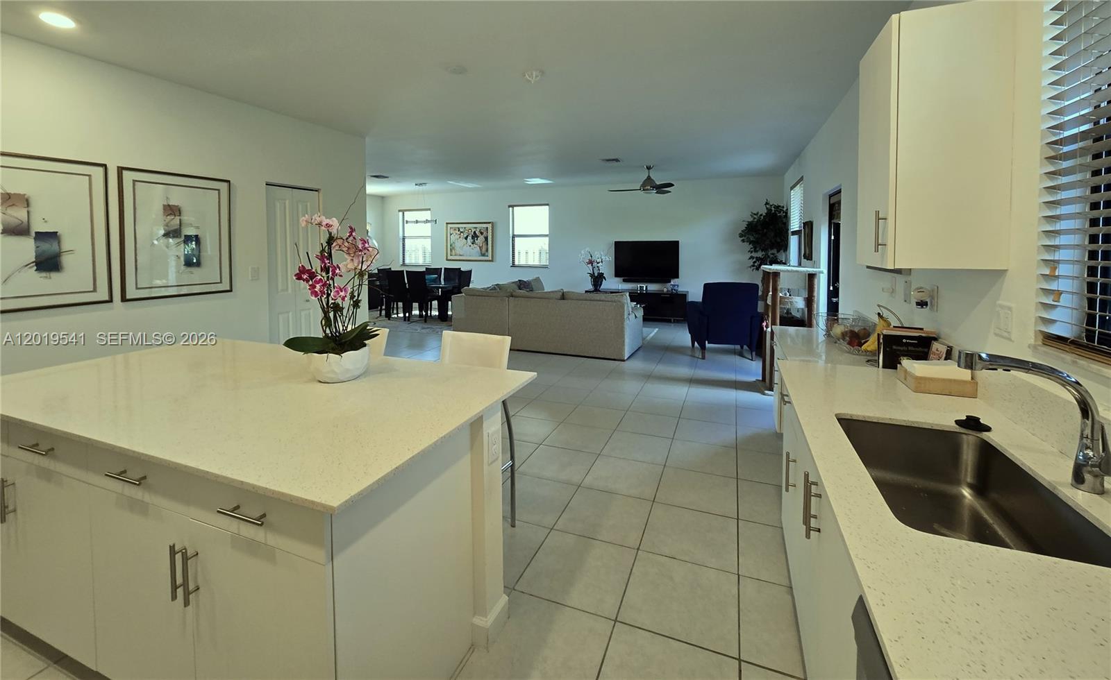 24400 Southwest 119th Place Homestead, FL 33032 - Photo 17 of 22 a large white kitchen with a sink and cabinets