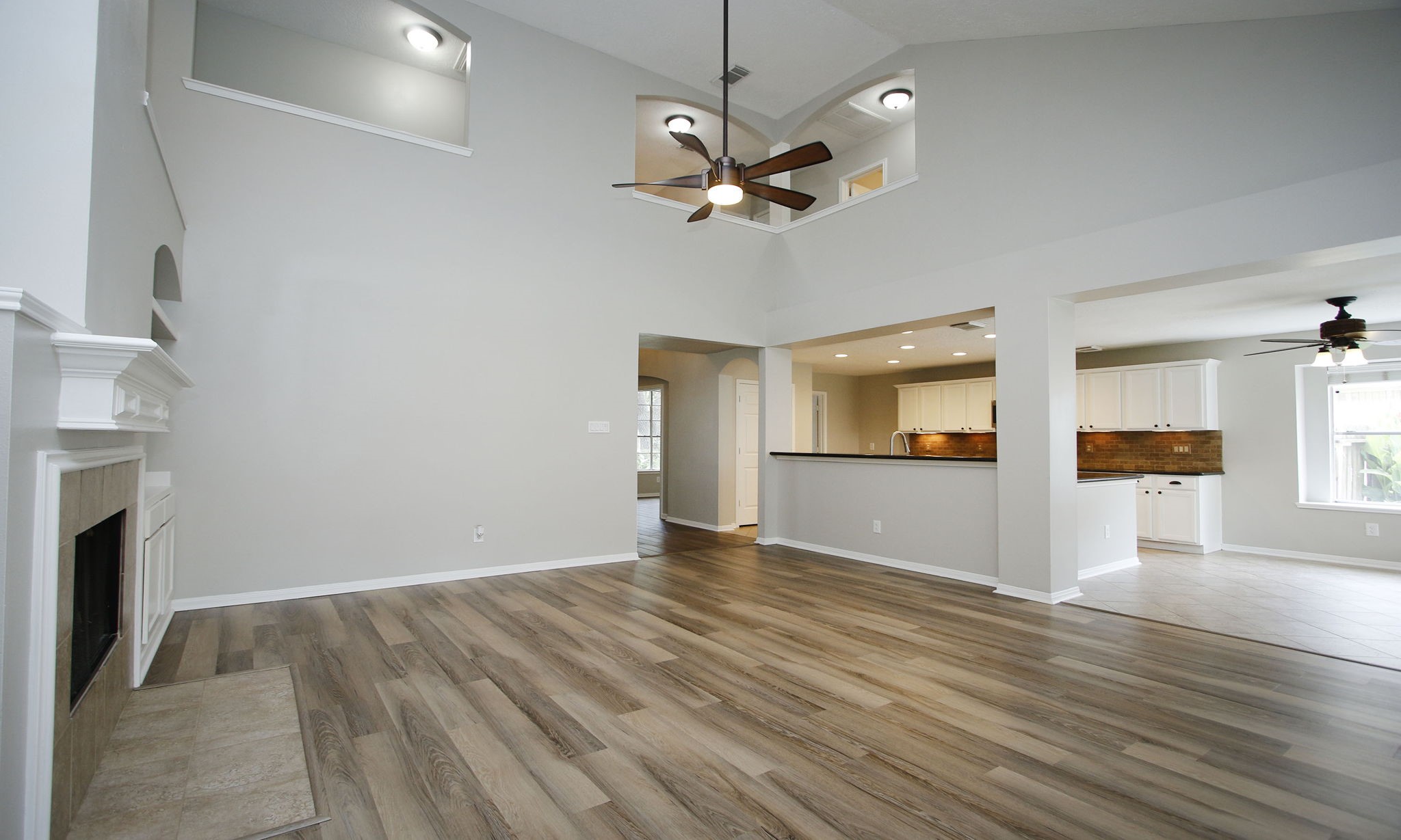 1915 West Welsford Drive Spring, TX 77386 - Photo 16 of 48 a view of empty room with wooden floor and fan