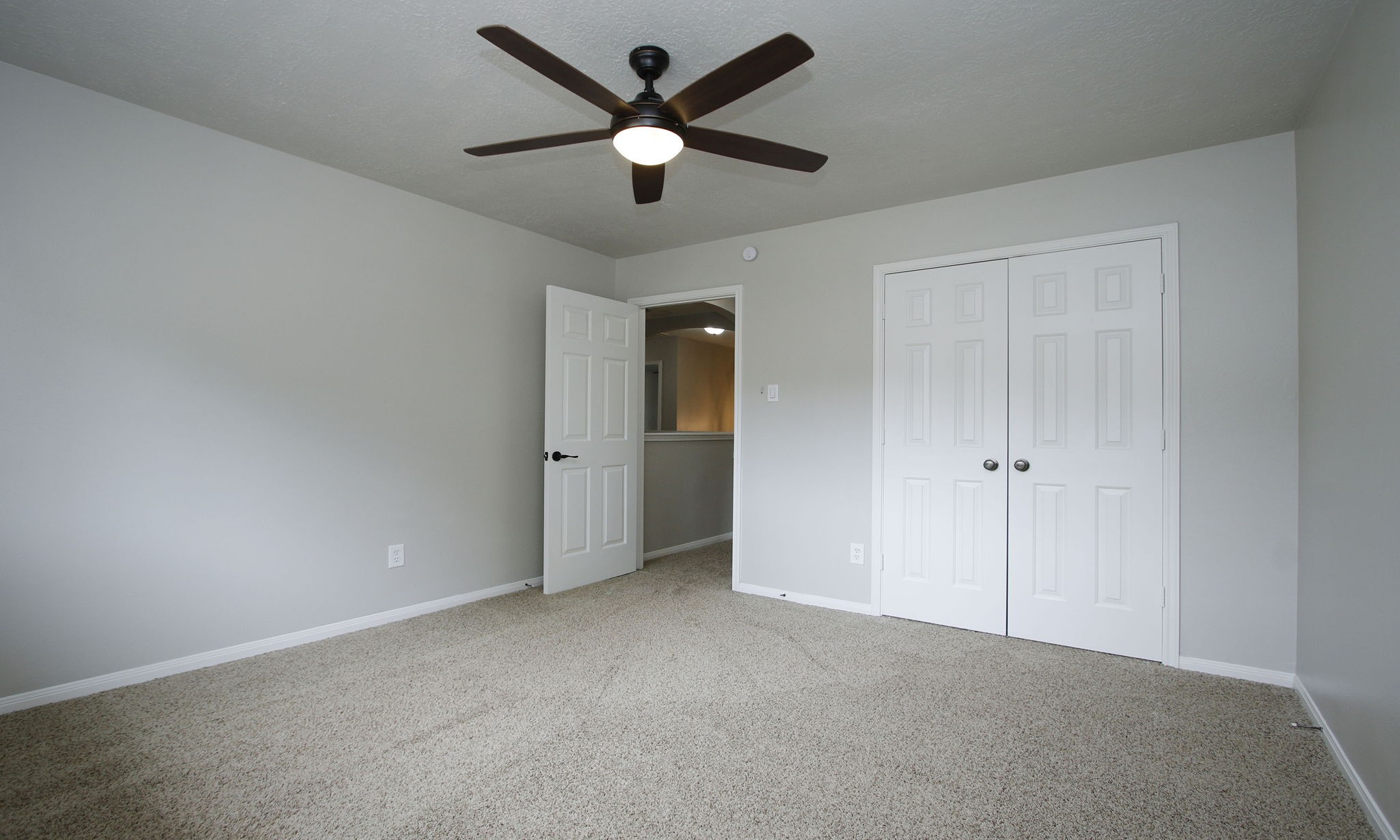 1915 West Welsford Drive Spring, TX 77386 - Photo 36 of 48 wooden floor in an empty room and a ceiling fan