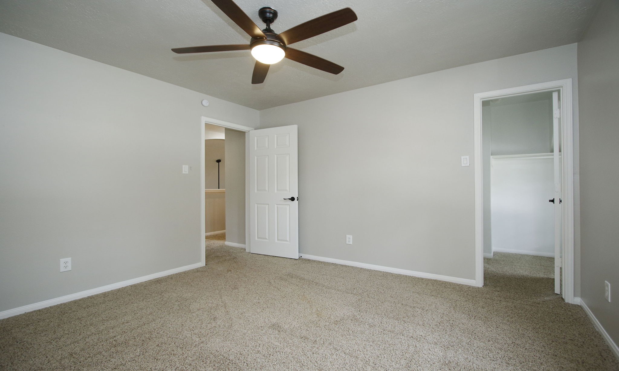 1915 West Welsford Drive Spring, TX 77386 - Photo 38 of 48 an empty room with closet and a chandelier fan
