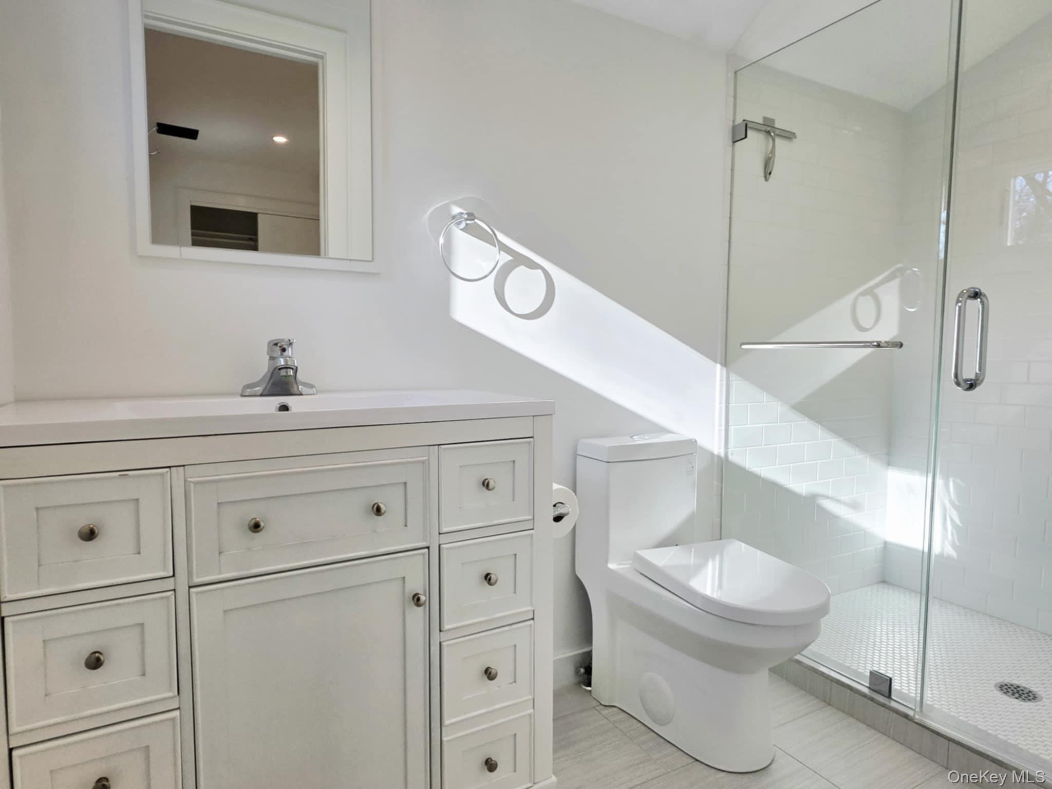 185 Wakeman Road Hampton Bays, NY 11946 - Photo 14 of 14 Bathroom with vanity and a shower stall
