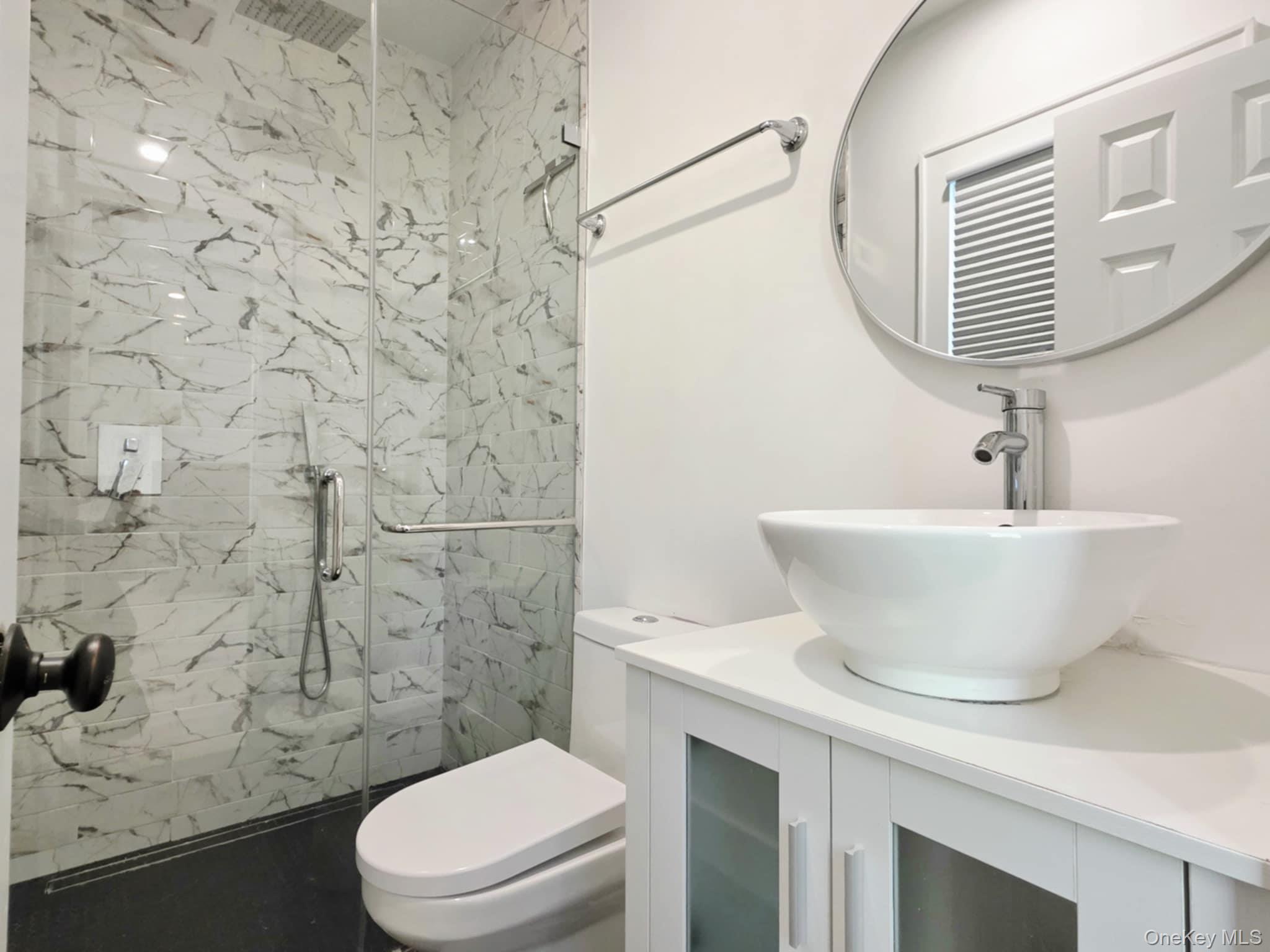 185 Wakeman Road Hampton Bays, NY 11946 - Photo 10 of 14 Full bathroom featuring a marble finish shower and vanity