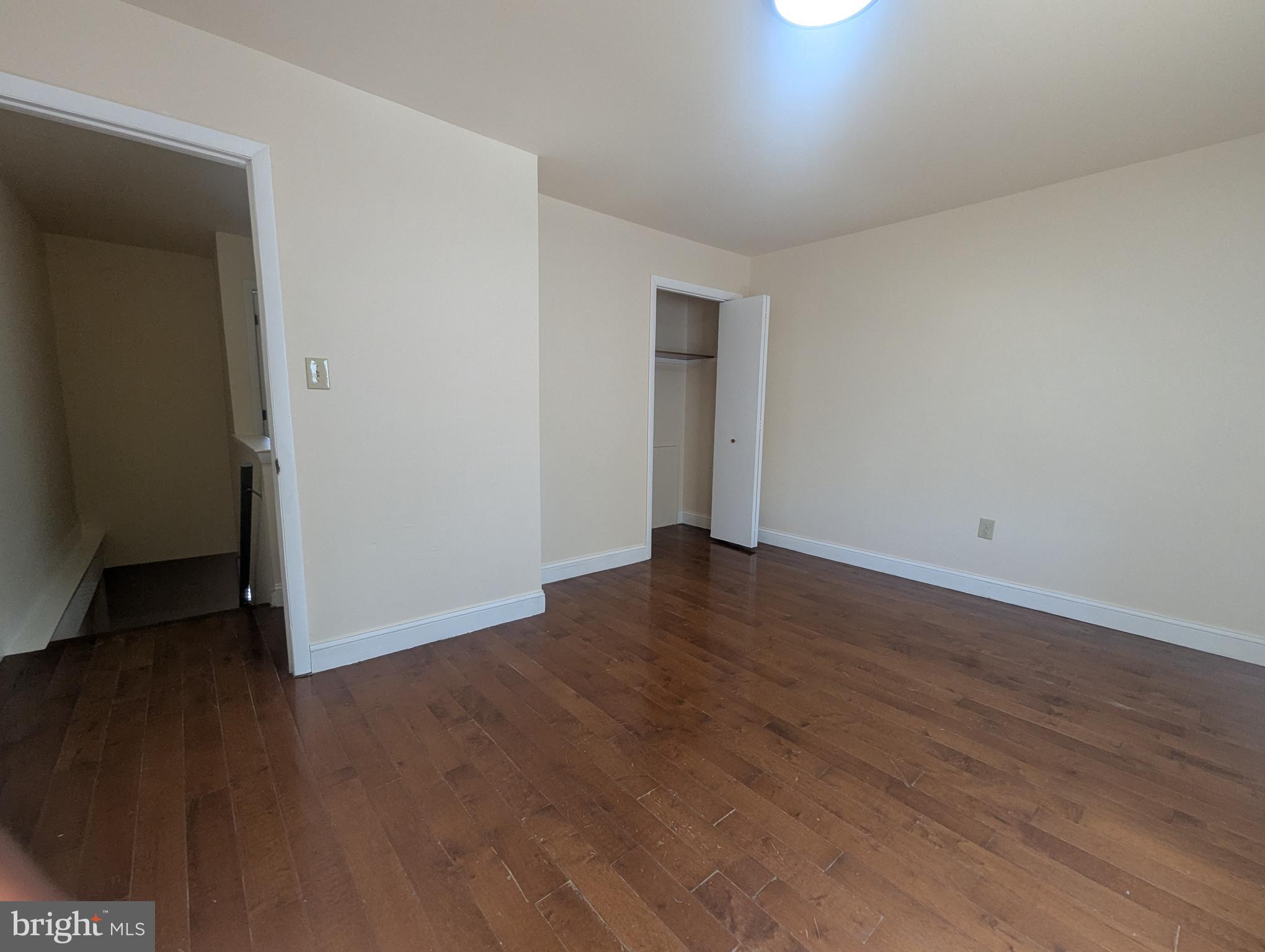 1624 West Diamond Street Philadelphia, PA 19121 - Photo 22 of 38 a view of an empty room with wooden floor and closet