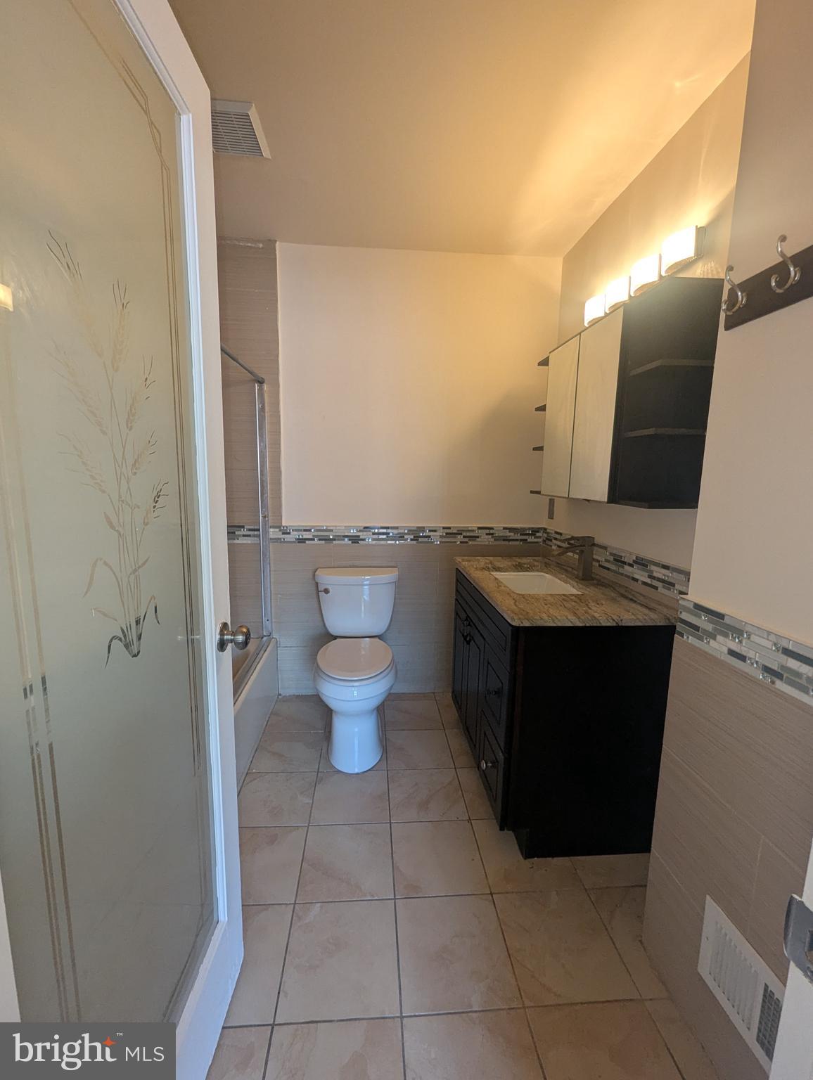 1624 West Diamond Street Philadelphia, PA 19121 - Photo 29 of 38 a bathroom with a sink and a mirror