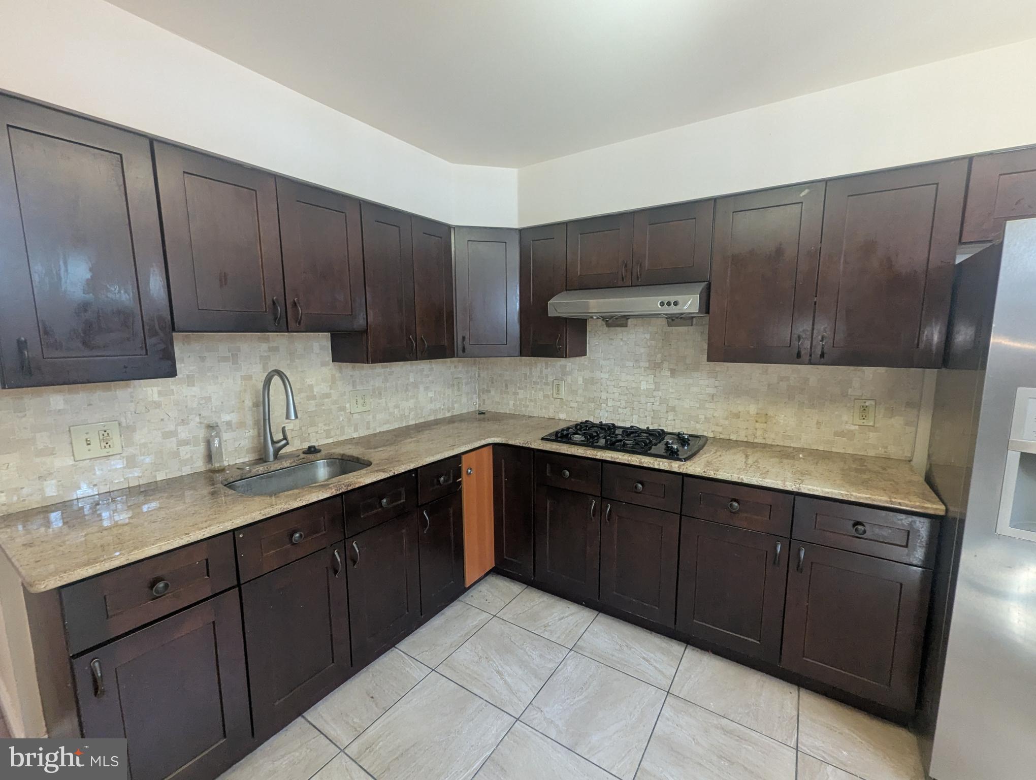 1624 West Diamond Street Philadelphia, PA 19121 - Photo 10 of 38 a kitchen with a sink and cabinets