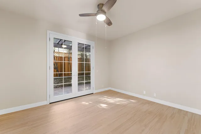 an empty room with a empty space and windows