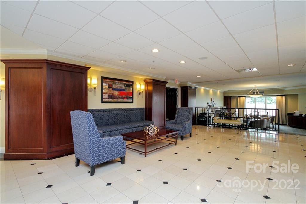 300 West 5th Street, Unit 339 Charlotte, NC 28202 - Photo 25 of 40 a lobby with furniture and couches