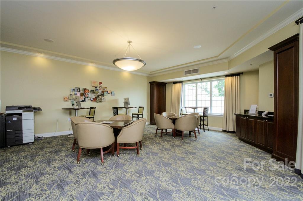 300 West 5th Street, Unit 339 Charlotte, NC 28202 - Photo 26 of 40 a living room with furniture and a table
