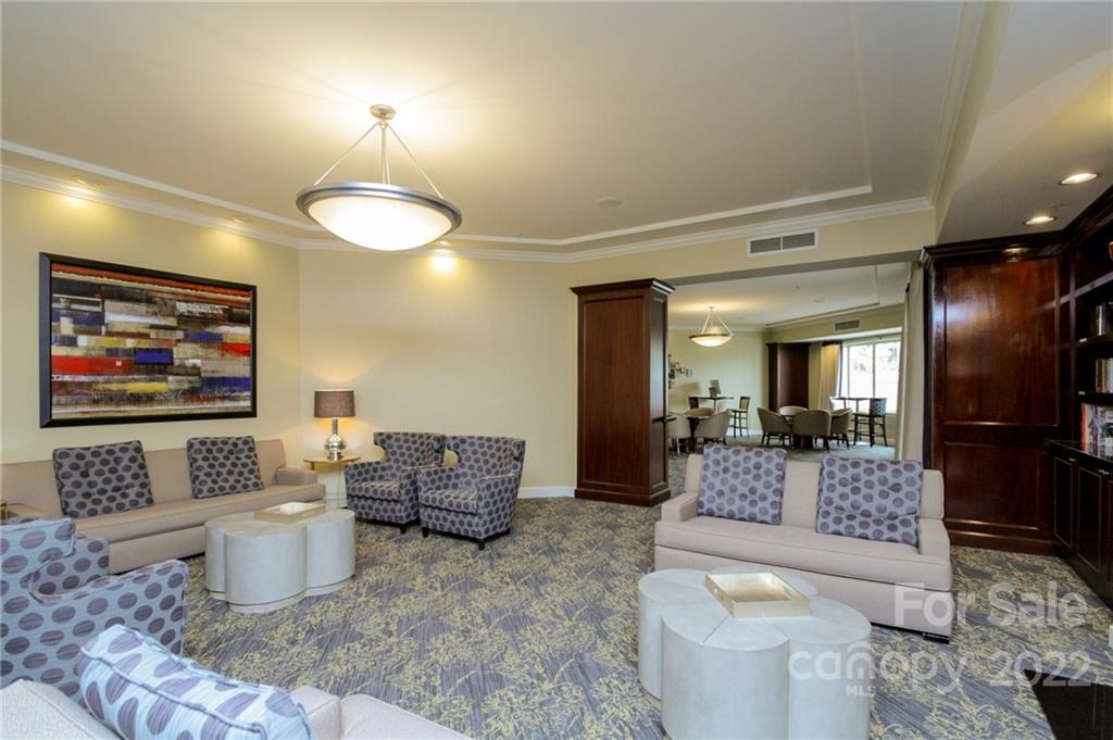 300 West 5th Street, Unit 339 Charlotte, NC 28202 - Photo 30 of 40 a living room with furniture and a flat screen tv