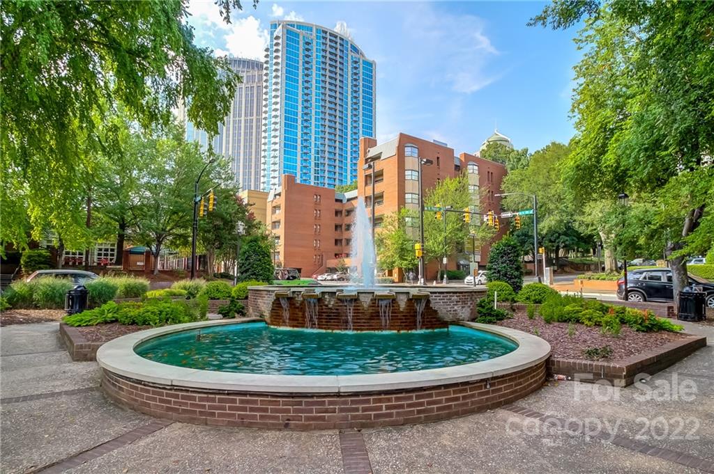 300 West 5th Street, Unit 339 Charlotte, NC 28202 - Photo 32 of 40 a view of a swimming pool with a yard and plants