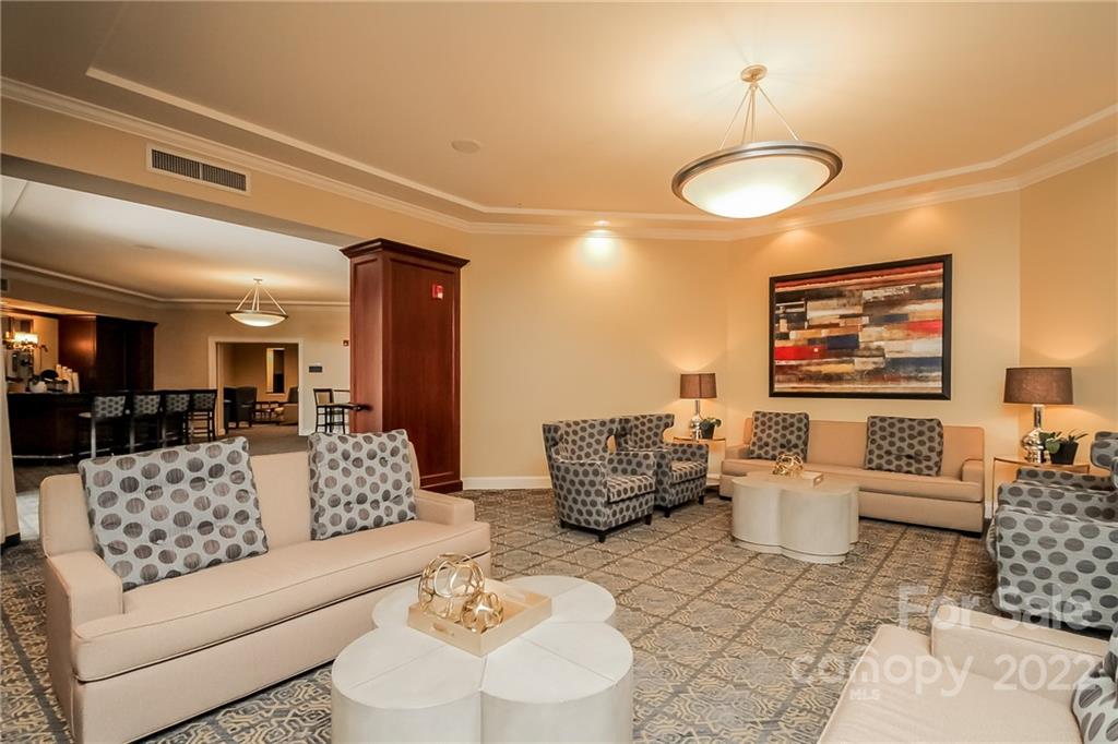 300 West 5th Street, Unit 339 Charlotte, NC 28202 - Photo 34 of 40 a living room with furniture and a table