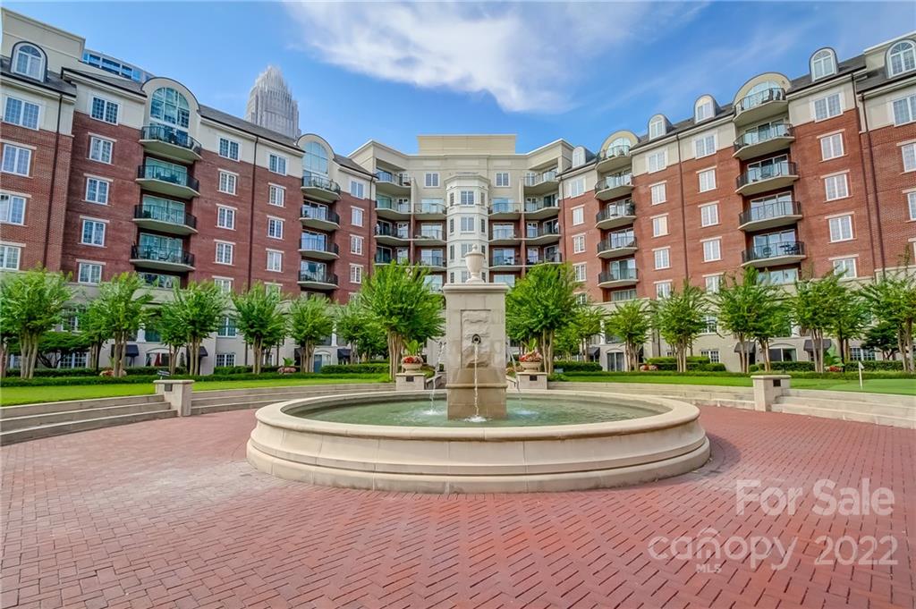 300 West 5th Street, Unit 339 Charlotte, NC 28202 - Photo 5 of 40 a view of building with yard and trees in the background