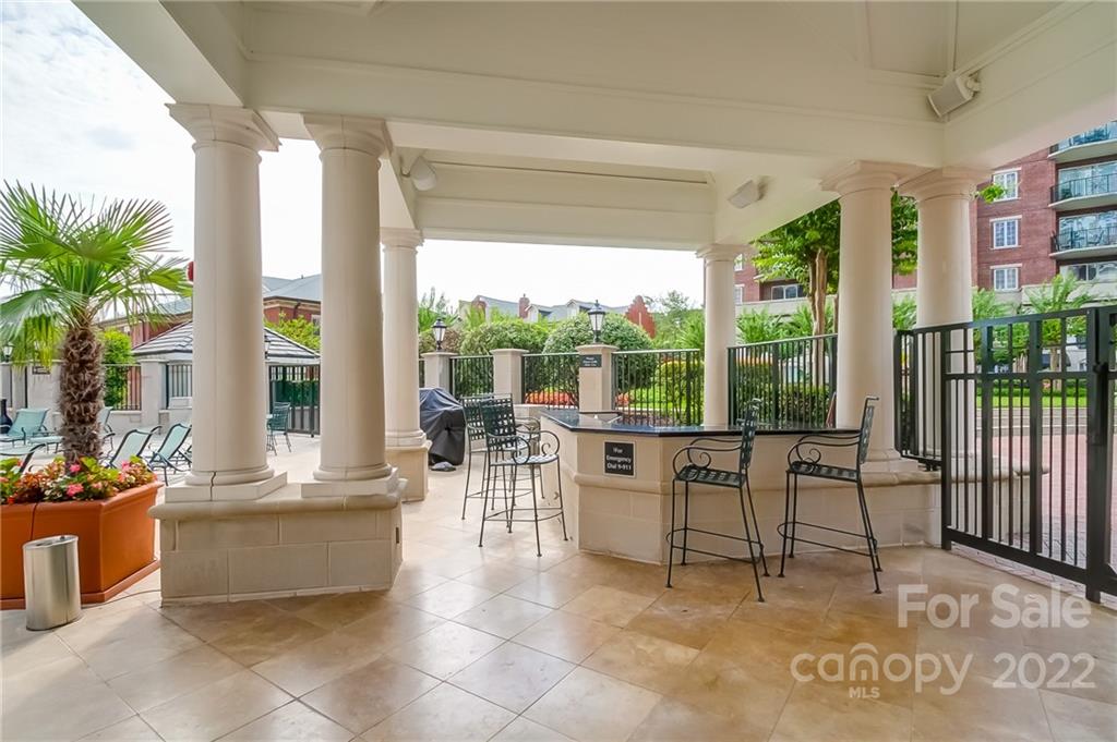 300 West 5th Street, Unit 339 Charlotte, NC 28202 - Photo 7 of 40 a living room with furniture and large windows