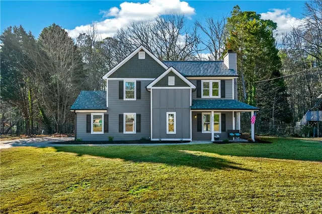 a front view of a house with a yard