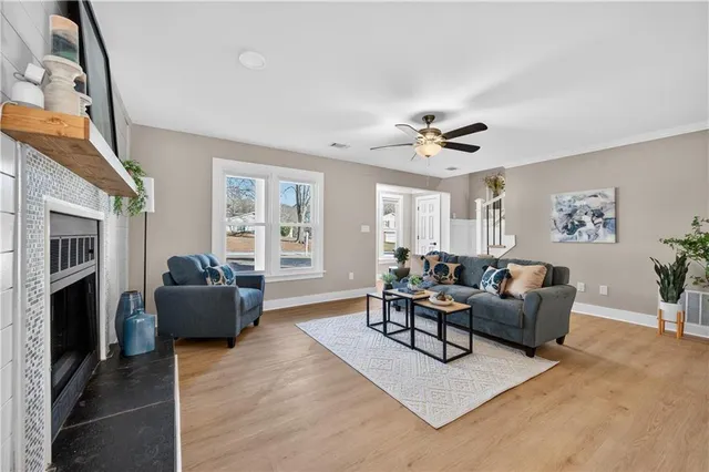 a living room with furniture and a fireplace