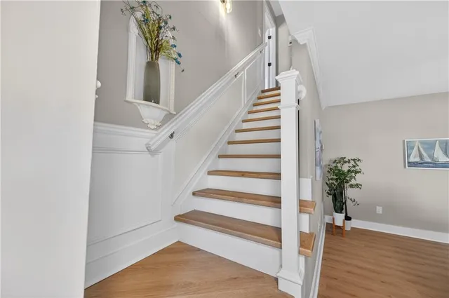 a view of entryway with wooden floor