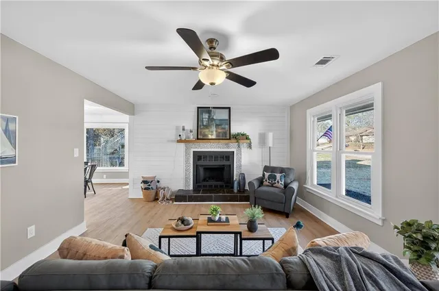 a living room with furniture and a fireplace