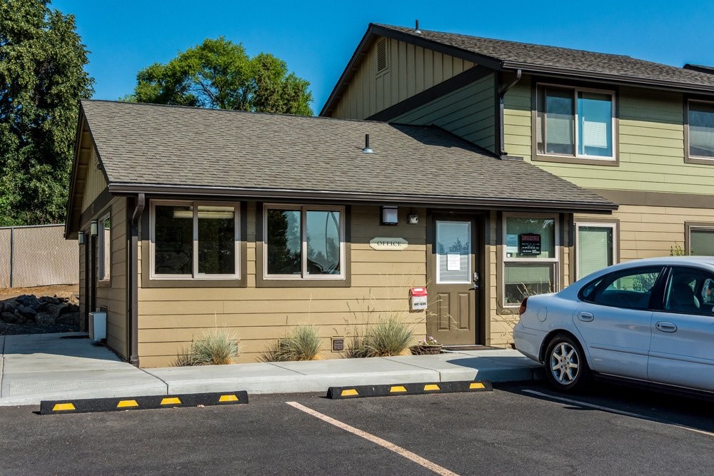 2050 Southwest Timber Avenue Redmond, OR 97756 - Photo 5 of 10 a car parked in front of a house