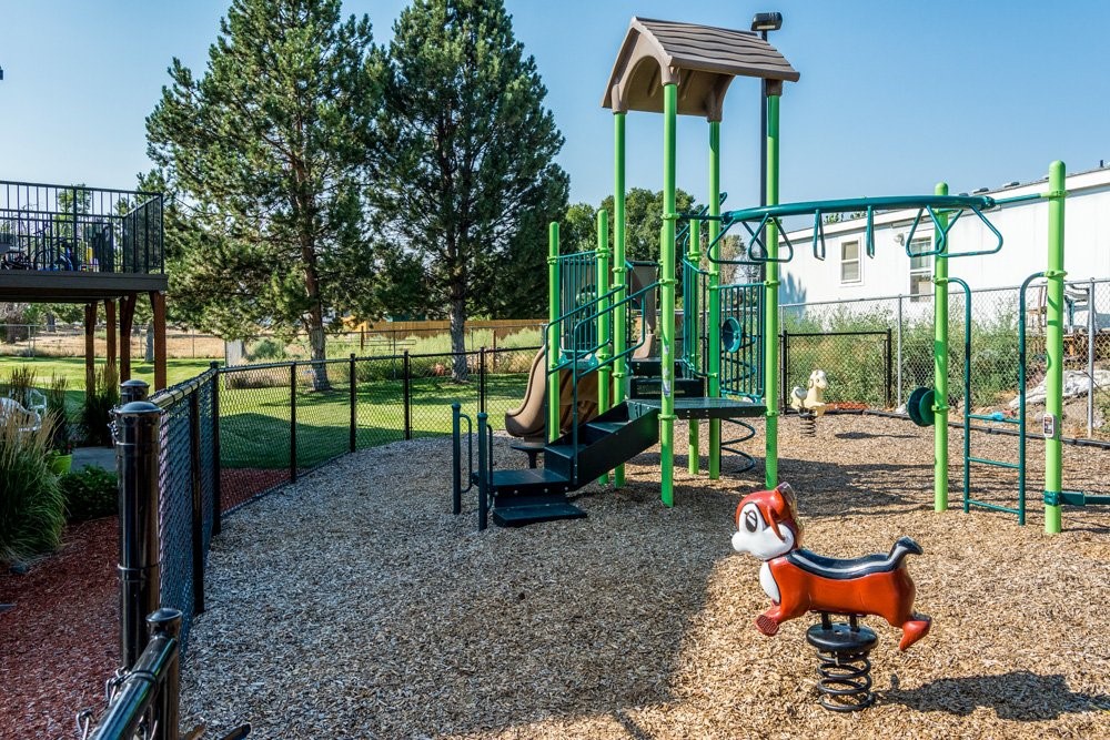 2050 Southwest Timber Avenue Redmond, OR 97756 - Photo 7 of 10 a garden with swimming pool and sitting area