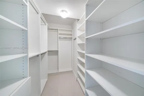 a view of an empty walk in closet