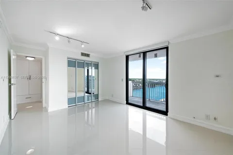 an empty room with sliding glass door