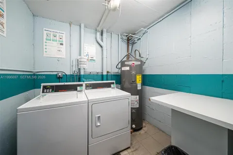 a view of walk in closet with clothes