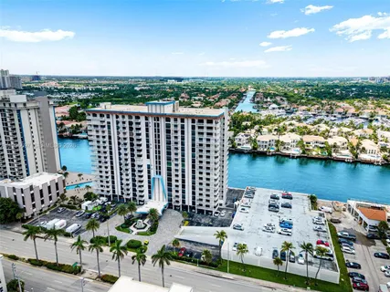 a white bench sitting in middle of a city