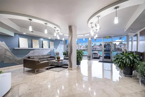 a living room with furniture and potted plants