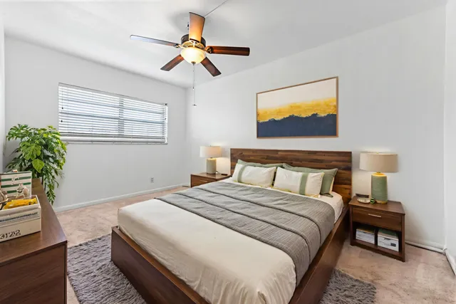 a bedroom with bed and window