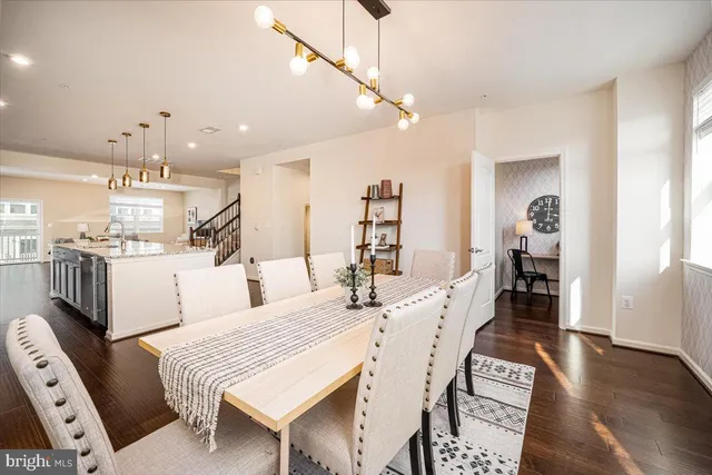 a large kitchen with a table and chairs