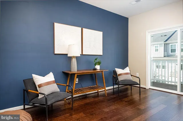 a workspace with wooden floor and a window