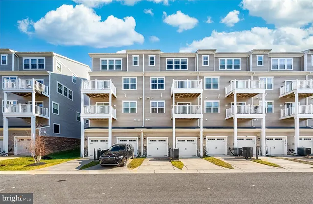 a view of parking garage with cars parked