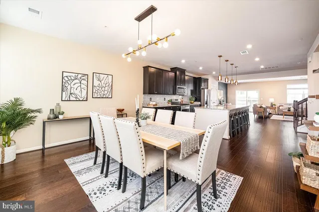 a view of a dining area with furniture and wooden floor
