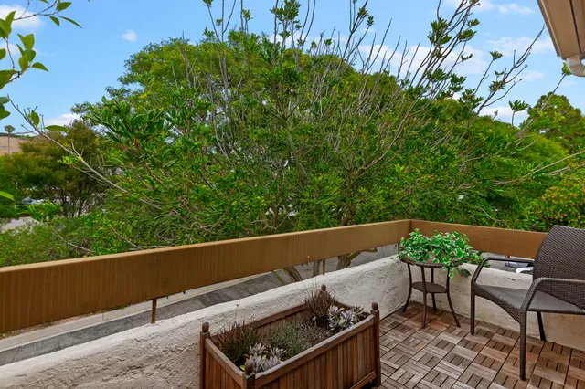 a view of outdoor sitting area with furniture