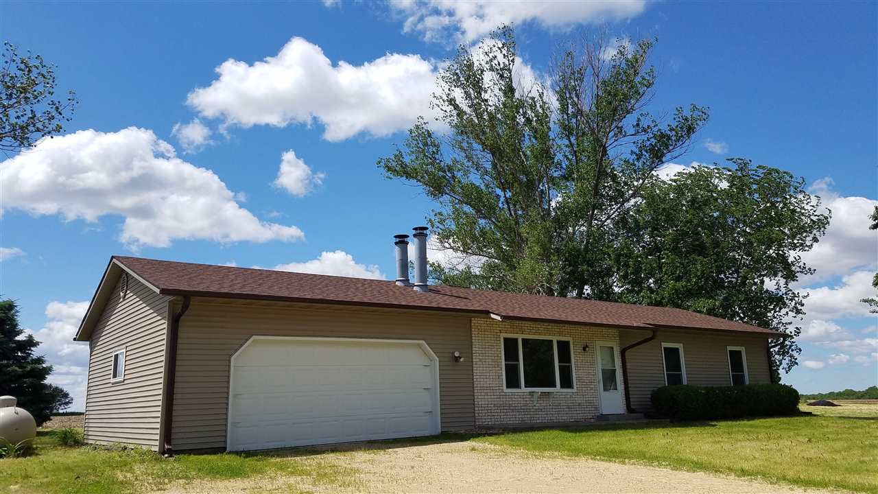 3065 East Stub Road Byron, IL 61010 - Photo 1 of 24 a front view of a house with garden