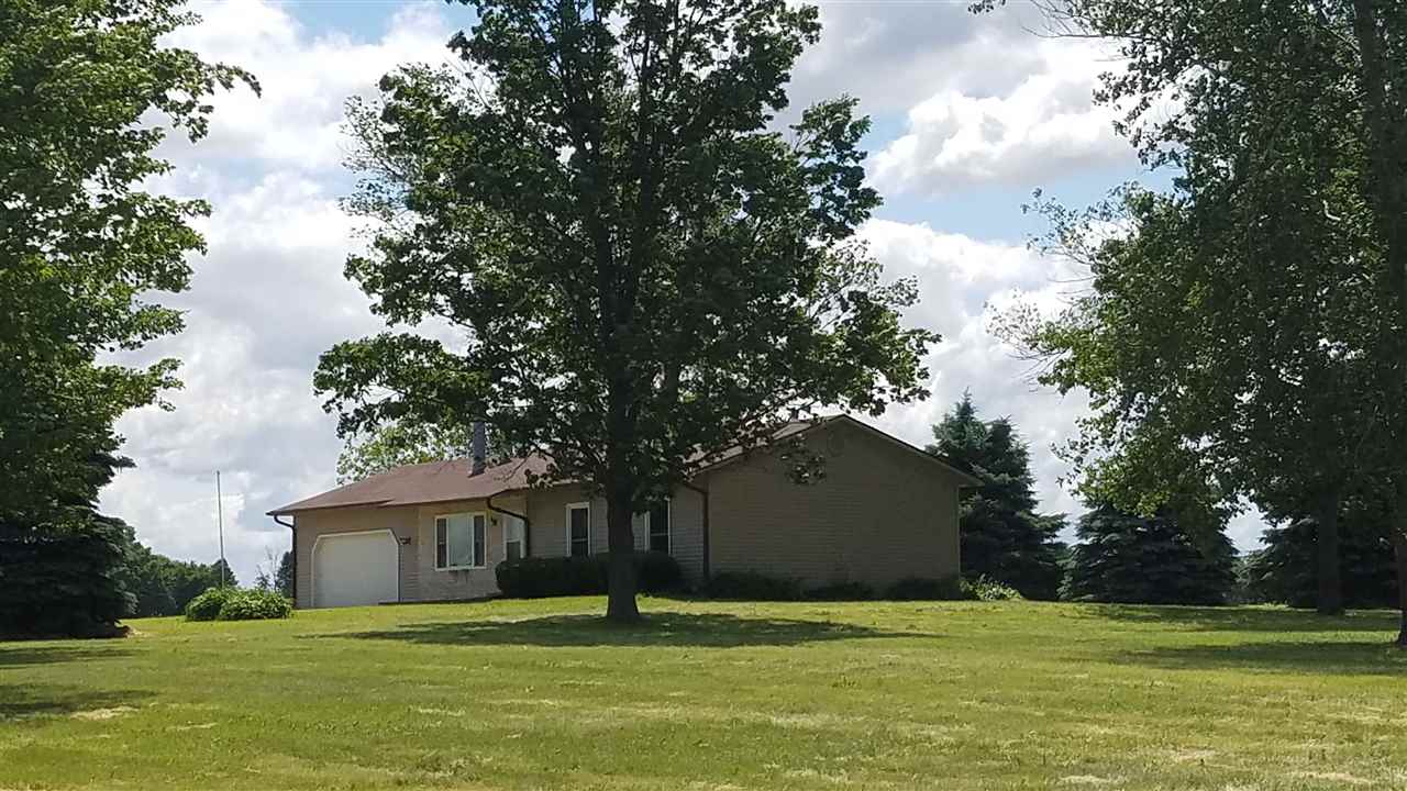 3065 East Stub Road Byron, IL 61010 - Photo 17 of 24 a house that has a tree in front of it