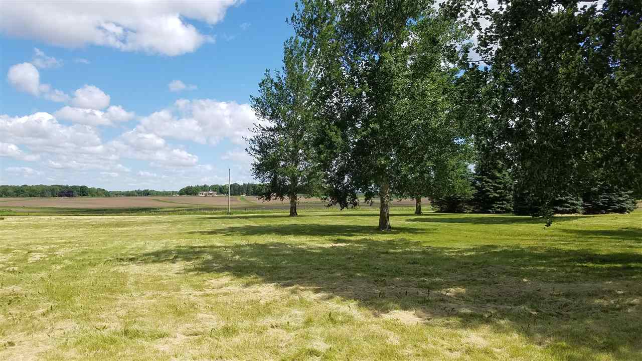 3065 East Stub Road Byron, IL 61010 - Photo 20 of 24 a view of an ocean with a big yard