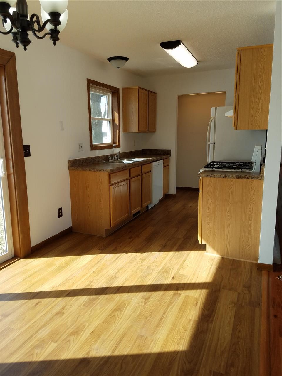 3065 East Stub Road Byron, IL 61010 - Photo 6 of 24 a kitchen with granite countertop a refrigerator and a stove