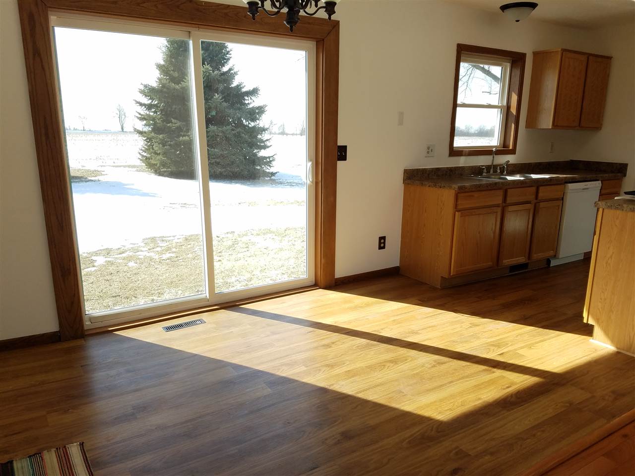 3065 East Stub Road Byron, IL 61010 - Photo 9 of 24 a view of empty room with wooden floor and fan